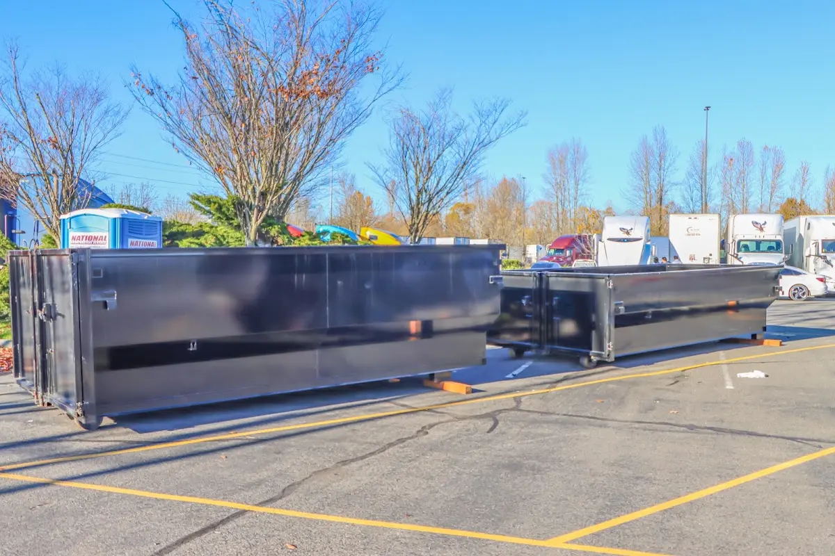 Professional dumpster rental service with roll-off container on residential driveway in Sachse